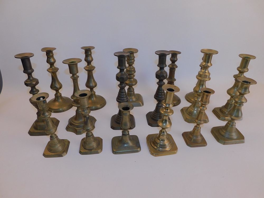 Appraisal: ANTIQUE BRASS CANDLE HOLDERS Lot of brass candlesticks from the