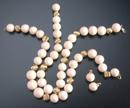 Appraisal: Two angel skin coral necklaces with fluted gold beads and