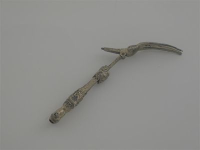 Appraisal: A continental parcel-gilt folding fork with a figural terminal a