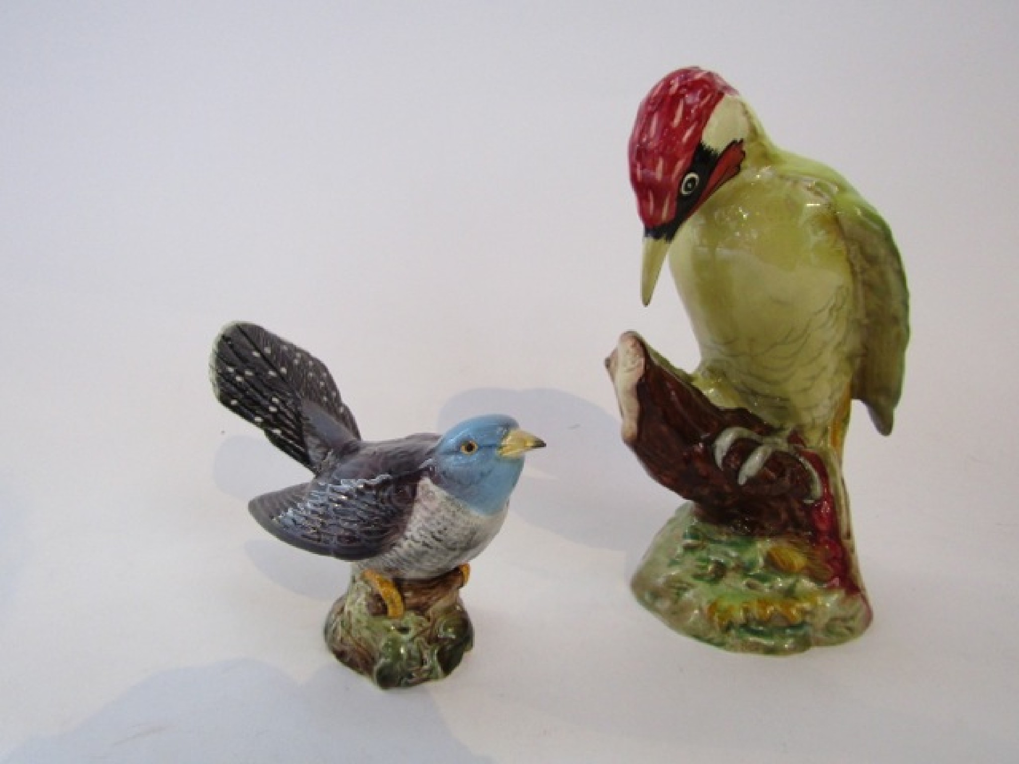 Appraisal: A large Beswick model of a green woodpecker with impressed