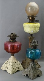 Appraisal: Three Victorian oil lamps with coloured glass and porcelain bowls