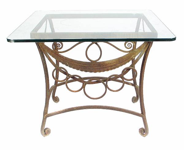 Appraisal: A wrought metal glass topped table crack to glass height