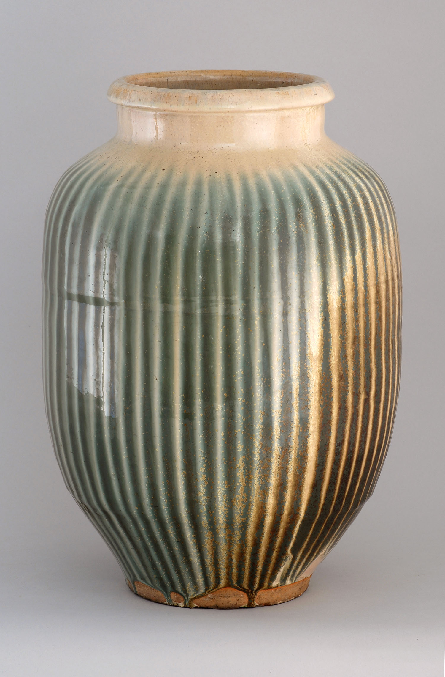 Appraisal: POTTERY VASE Shino Circa In seed form with vertical striped