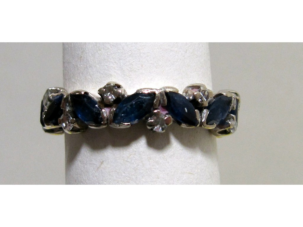 Appraisal: White metal marquise cut sapphire and diamond set full hoop