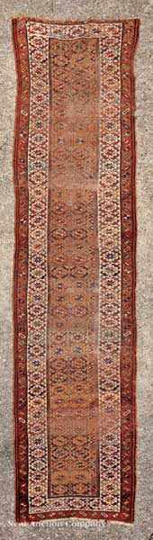 Appraisal: A Persian Runner gold and crimson ground allover geometric design