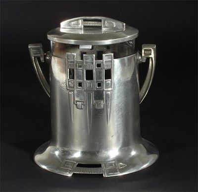 Appraisal: A Urania pewter and glass biscuit barrel and cover the