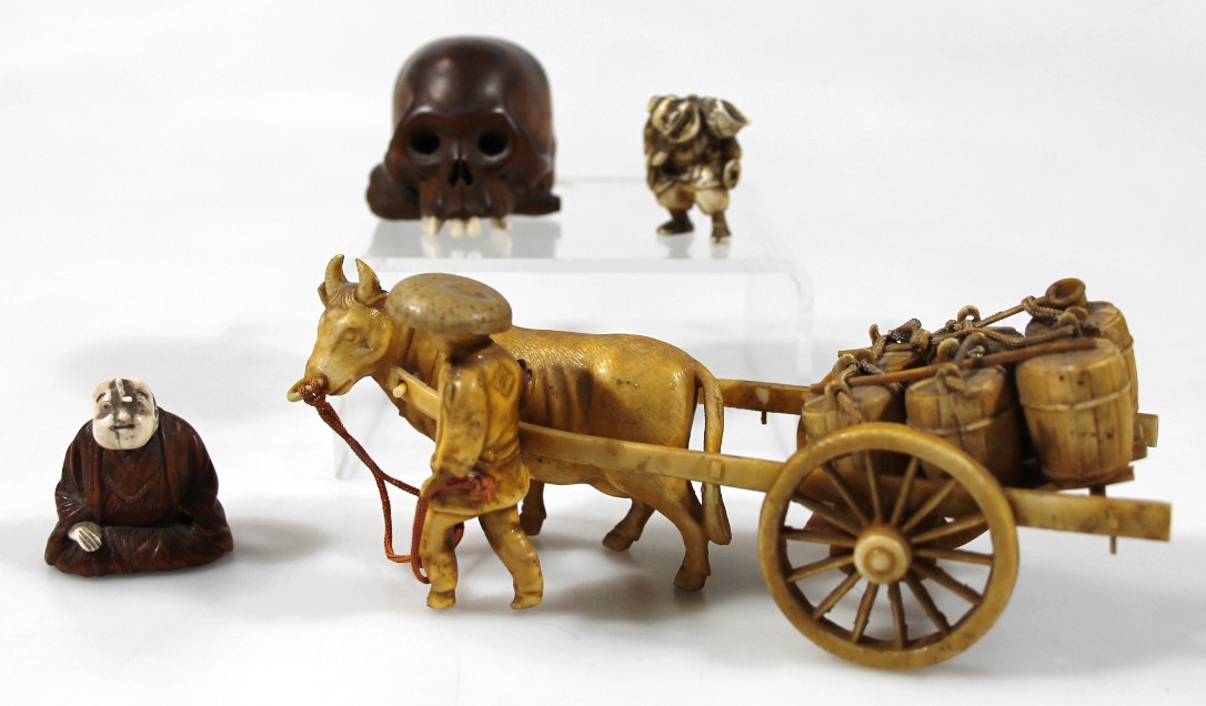 Appraisal: A figure group of oxen pulling cart with barrels probably