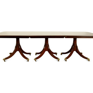 Appraisal: A Regency Style Mahogany Triple Pedestal Dining Table TH CENTURY