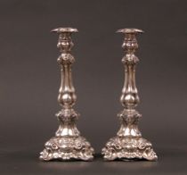 Appraisal: Ornate Silver Candlesticks Silver candlesticks have an ornate design of