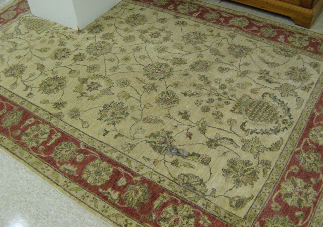 Appraisal: HAND KNOTTED ORIENTAL CARPET Pakistani-Persian overall scrolling floral vine design