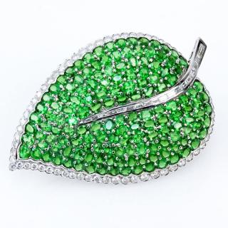 Appraisal: Carat Oval Cut Tsavorite Garnet Carat Round Brilliant and Tapered