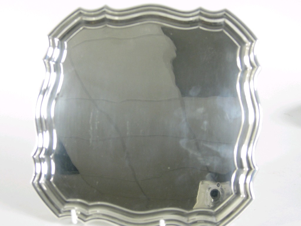 Appraisal: A George VI shaped square Salver on four ball and