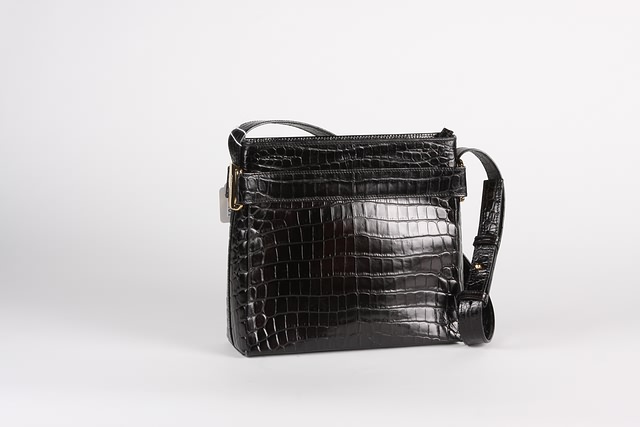 Appraisal: Salvatore Ferragamo black alligator handbag with adjustable shoulder strap gold