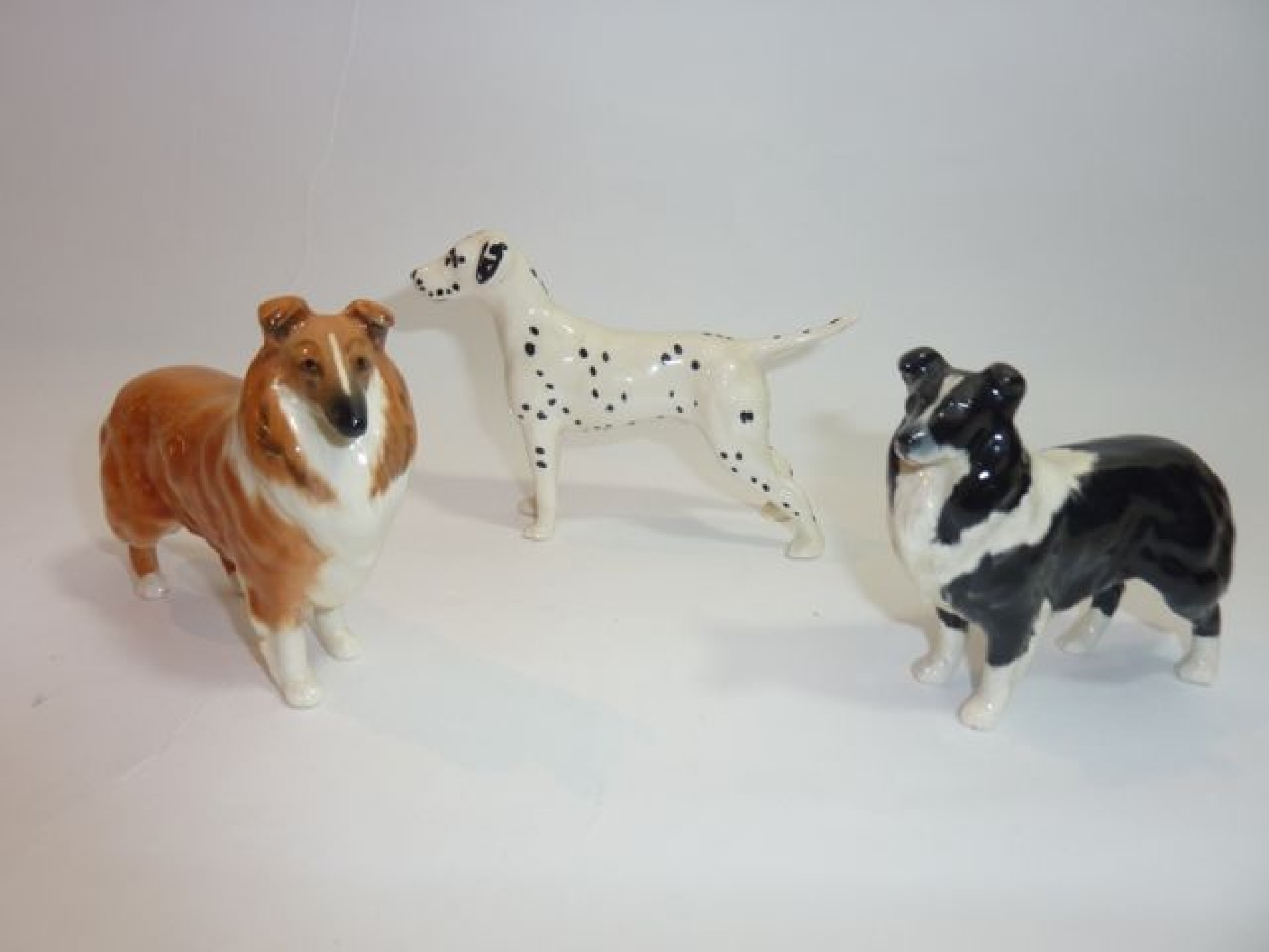 Appraisal: A collection of three Beswick model dogs comprising a Dalmatian