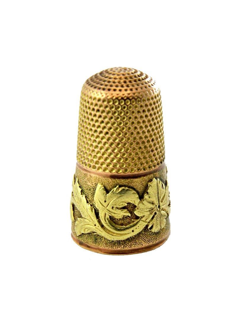 Appraisal: A Victorian two colour gold thimble the wide band with