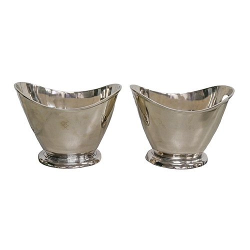 Appraisal: A pair of polished metal champagne buckets cm h More