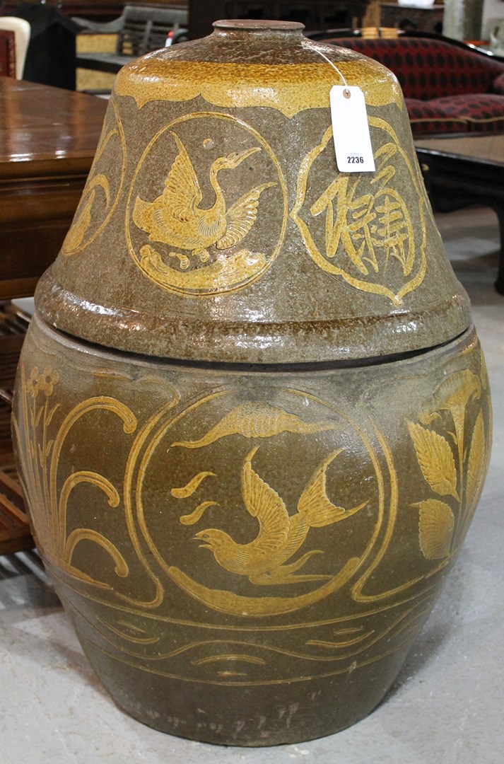 Appraisal: A near pair of terracotta jardinieres and covers slip decorated