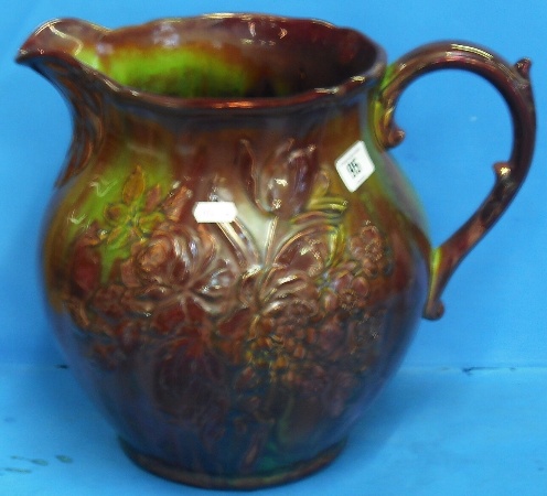 Appraisal: Large Continental Floral Embossed Flambe Lustre Style Jug Height cm