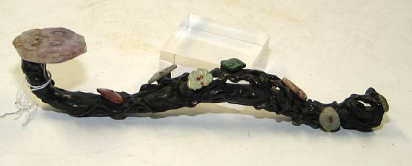 Appraisal: A hardstone-mounted wood ruyi scepter Its fungus shaped head of