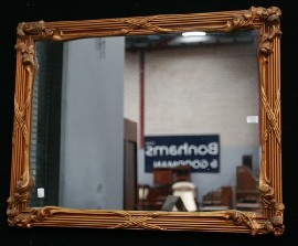 Appraisal: A rectangular gilt framed mirror