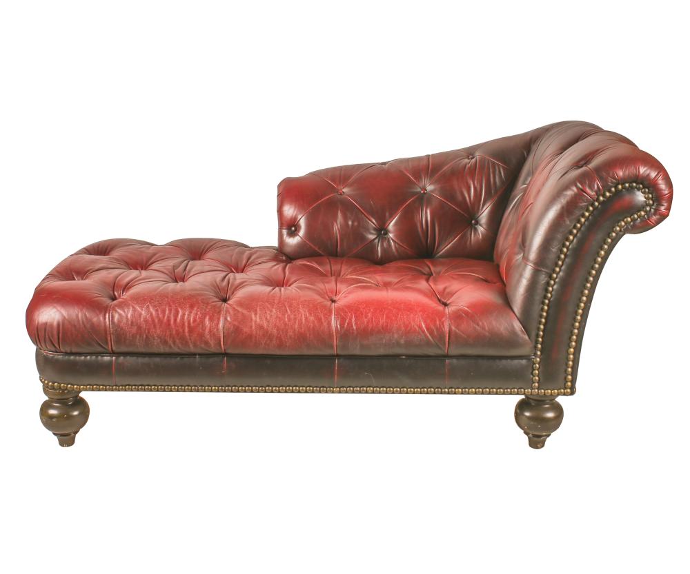 Appraisal: BURGUNDY LEATHER-COVERED CHAISE LONGUEcontemporary Condition leather distressed nicks and chips