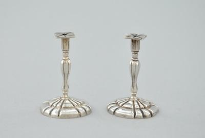 Appraisal: A Pair of Miniature Silver Candlesticks Both unmarked the shaped