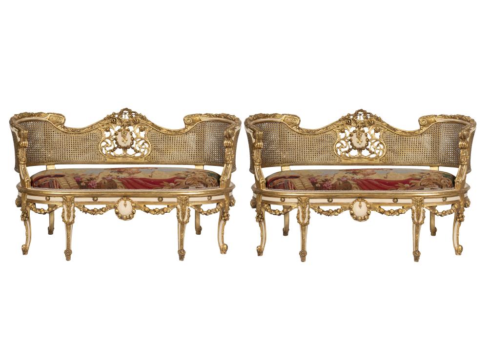 Appraisal: PAIR OF CANED GILT PAINTED WOOD SETTEESwith tapestry-style upholstery inches