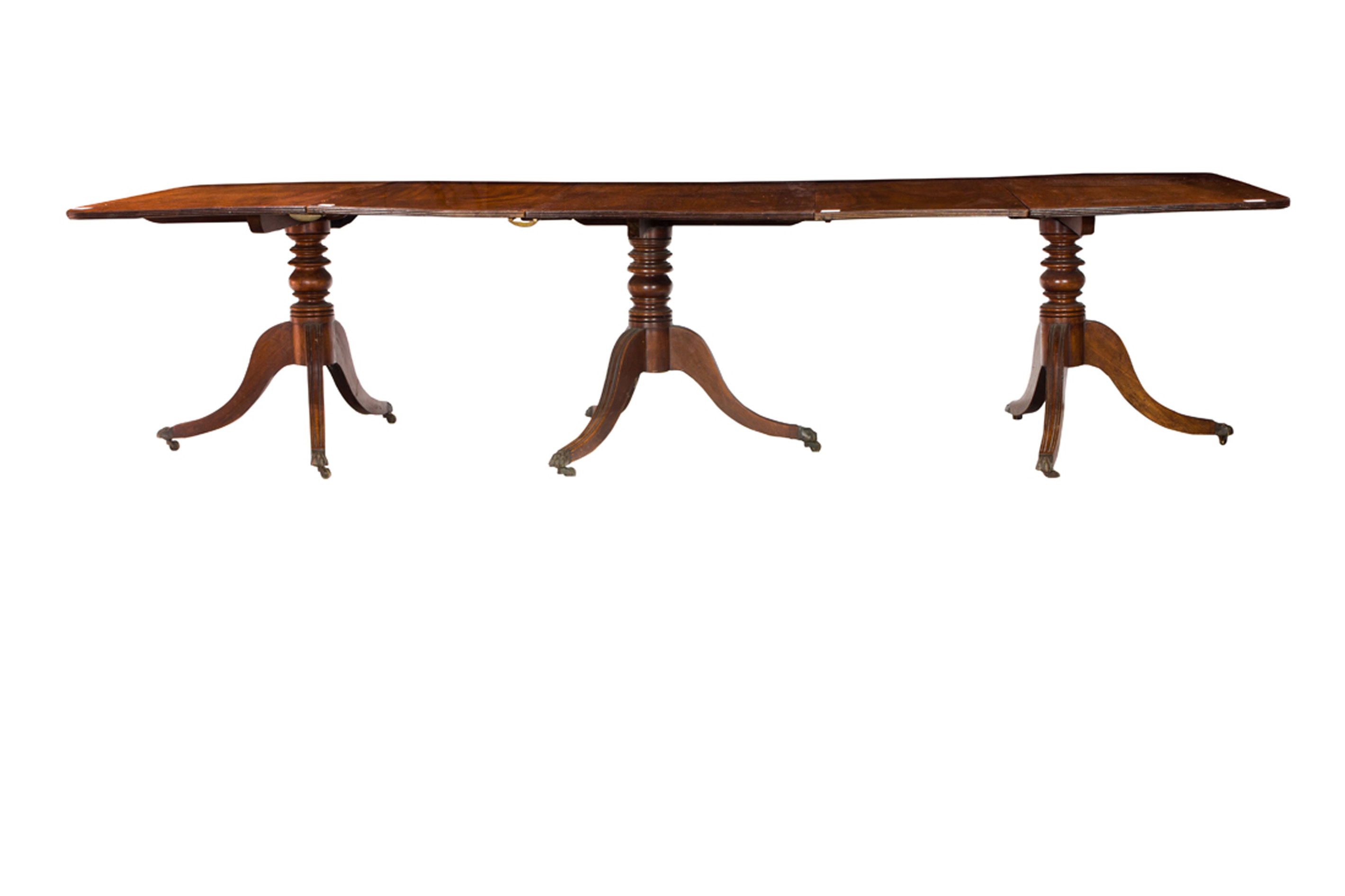 Appraisal: A REGENCY MAHOGANY TRIPLE PEDESTAL BANQUET TABLE A Regency mahogany