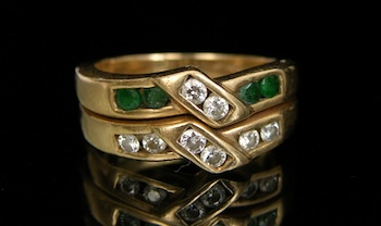 Appraisal: A Double Ring with Emeralds and Diamonds k yellow gold