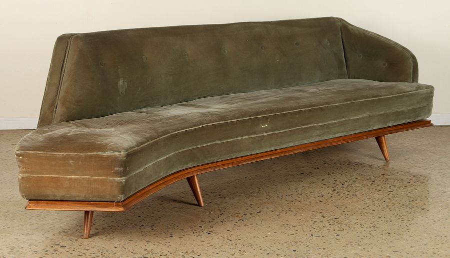 Appraisal: ITALIAN UPHOLSTERED CURVED SOFA CIRCA An Italian upholstered curved sofa