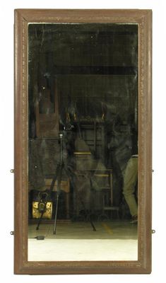 Appraisal: A late Victorian oak rectangular wall mirror the concave sided