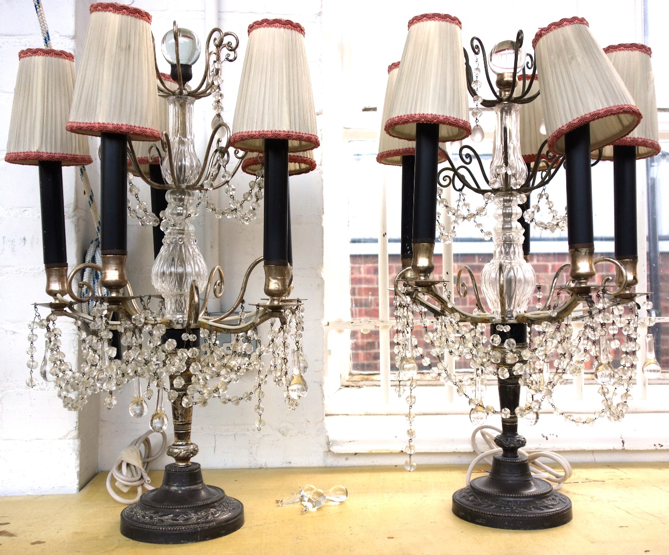 Appraisal: A pair of silvered metal and glass mounted five branch