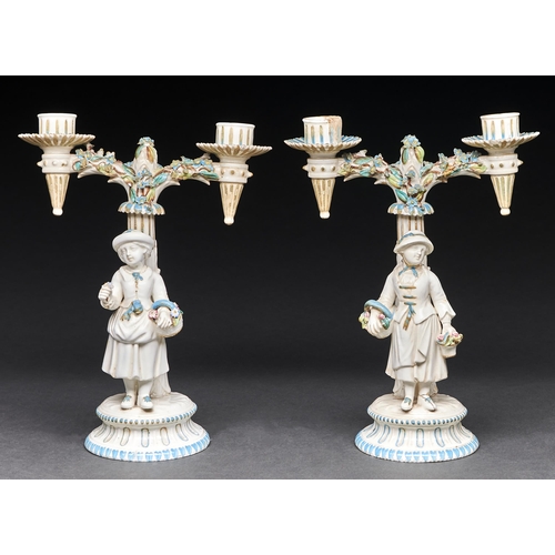 Appraisal: A pair of John Bevington floral encrusted candelabra c the