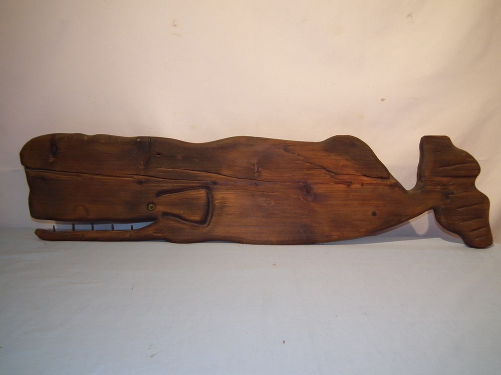 Appraisal: VINTAGE WOOD WHALE PLAQUE Old carved pine whale plaque incised