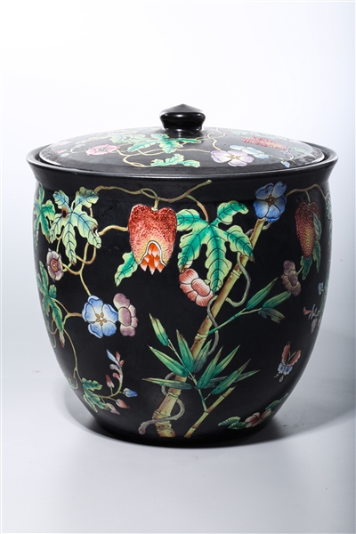 Appraisal: Chinese black ground enameled porcelain covered jar with plants and