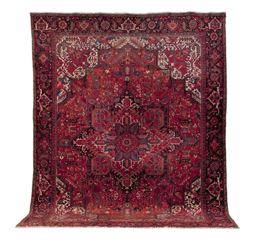 Appraisal: Heriz carpet ca with a central medallion on a red