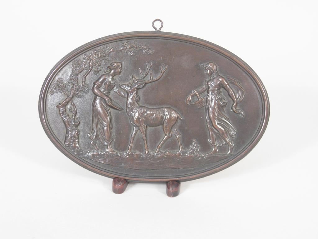 Appraisal: A th Century Coalbrookdale oval bronzed Plaque depicting two maidens