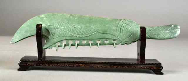 Appraisal: A Chinese Carved Hardstone SwordCarved on each side to depict