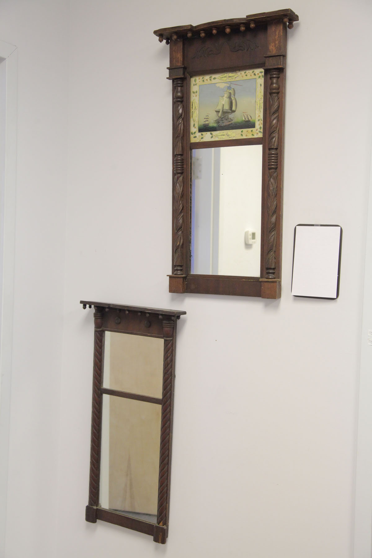 Appraisal: TWO FEDERAL STYLE MIRRORS American early th century Mahogany framed