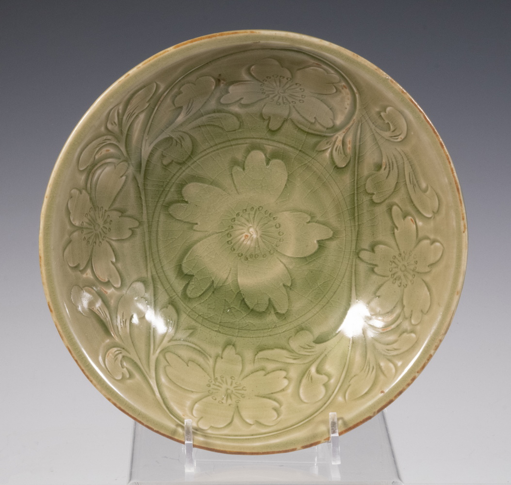 Appraisal: CHINESE CELADON BOWL Ming Dynasty with carved floral decoration fluted