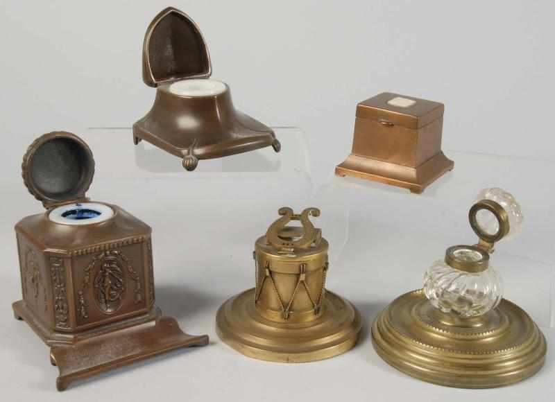 Appraisal: Lot of Brass Inkwells Description Includes one with glass holder