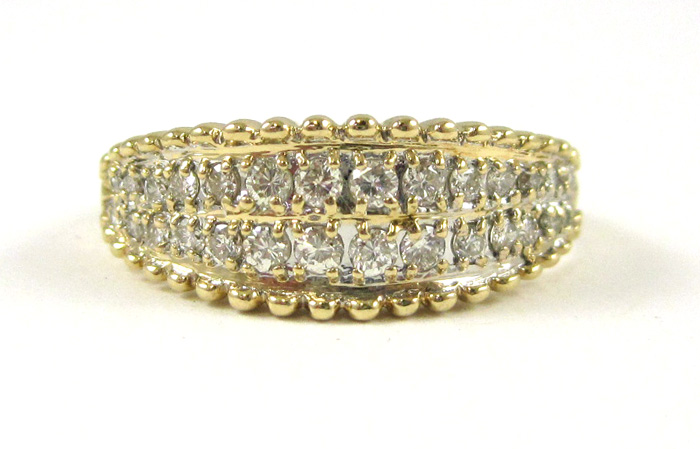 Appraisal: DIAMOND AND FOURTEEN KARAT GOLD RING set with round-cut diamonds