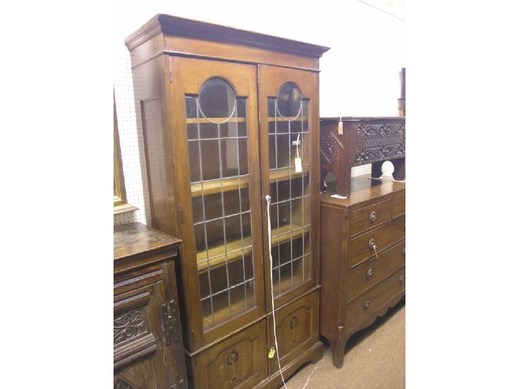 Appraisal: An Art Nouveau solid medium oak bookcase three adjustable shelves