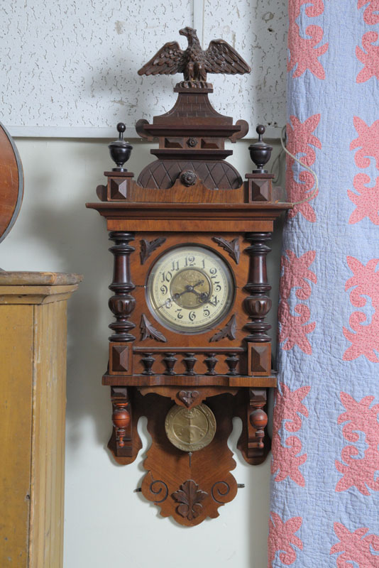 Appraisal: WALL CLOCK Eight day time strike with brass works Ornately