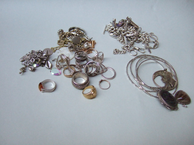 Appraisal: Mostly silver jewellery including a charm bracelet a watch Albert