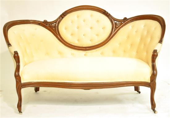 Appraisal: Victorian camelback settee button tufted back cream upholstery shaped front