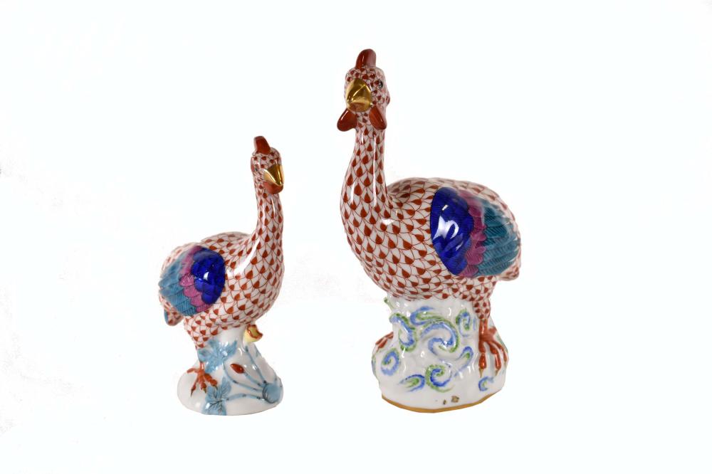 Appraisal: TWO HEREND FISHNET PORCELAIN HENSThe undersides marked Colorfully decorated on