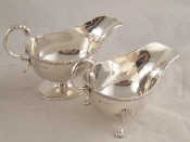 Appraisal: A footed silver sauce boat London and another on three