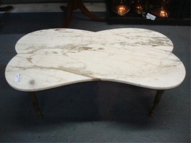 Appraisal: Marbletop coffee table w brass legs Dimensions Approx x x