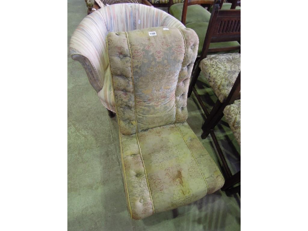 Appraisal: A Victorian nursing chair with floral and buttoned upholstery raised